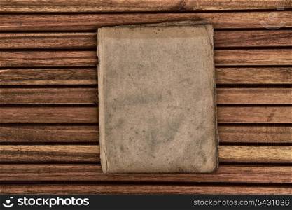 very old paper on wooden background