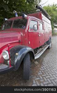 very old red mercedes fire truck parked in the netherlands