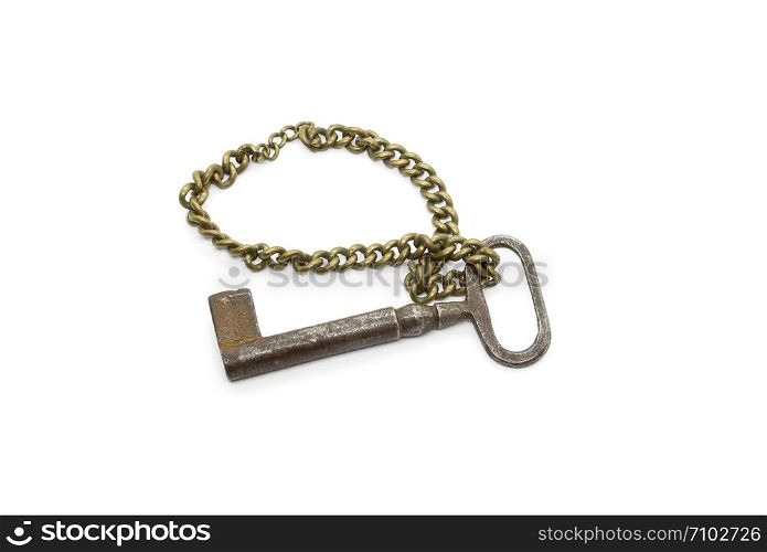 Very old vintage iron rusty key on a thick chain, isolated on white background