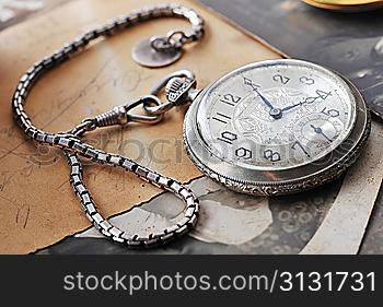 very old watch on the grungde post card and photo