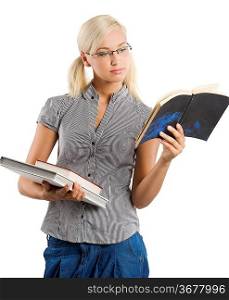 very pretty teacher in casual dress wearing glasses and reading on a book