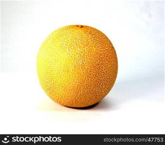Very ripe melon of orange color on a white bottom.