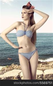 very sexy blonde girl with bikini and vintage foulard in the long hair posing like pin-up in summer shoot