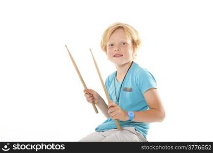 very young drummer against white background