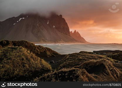 Vestrahorn mountain and dunes at sunrise in a cloudy day, Iceland. Vestrahorn mountain in Iceland