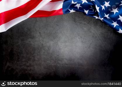 Veterans day. Honoring all who served. American flag on gray background with copy space.