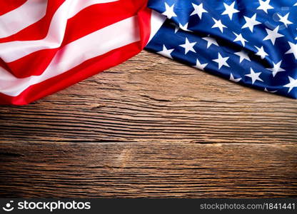 Veterans day. Honoring all who served. American flag on wooden background with copy space.