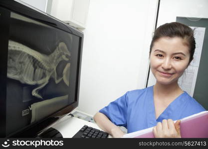 Veterinarian next to animal&rsquo;s x-ray, portrait