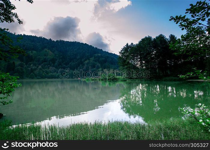 Vew of Karagol (Black lake) a popular destination for tourists,locals,campers and travelers in Eastern Black Sea,Savsat, Artvin, Turkey. Landscape view of Karagol (Black lake) in Savsat,Artvin,Turkey