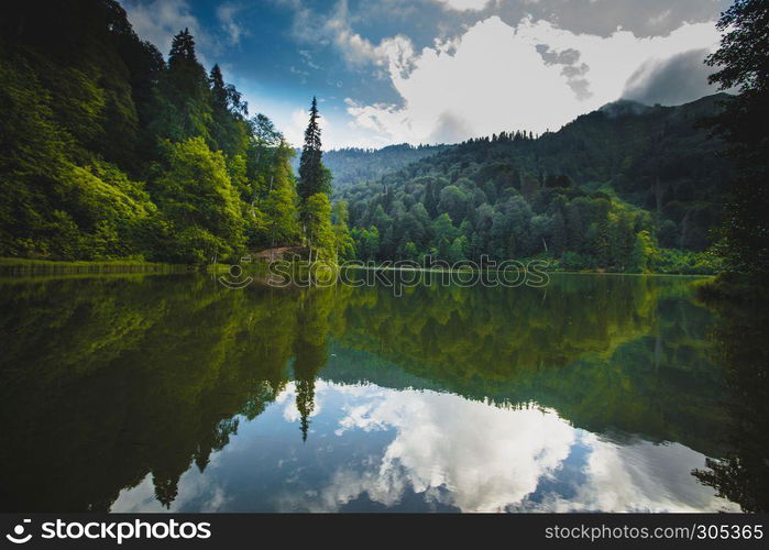 Vew of Karagol (Black lake) a popular destination for tourists,locals,campers and travelers in Eastern Black Sea,Savsat, Artvin, Turkey. Landscape view of Karagol (Black lake) in Savsat,Artvin,Turkey