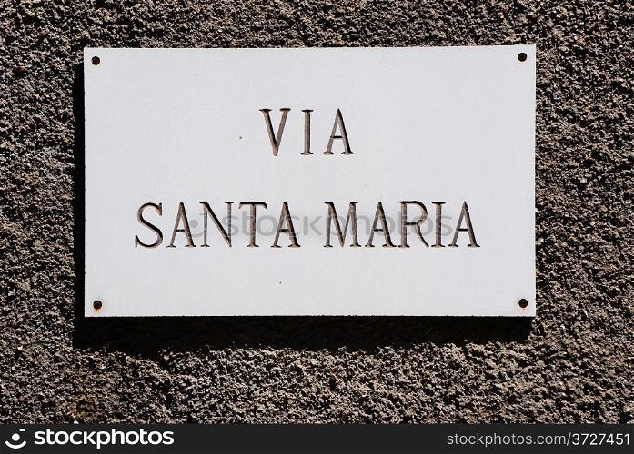 Via Santa Maria Street Sign on the Building of Italian Town
