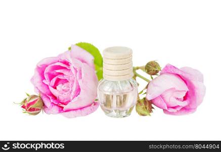 Vial with essential oil and two roses isolated on a white background