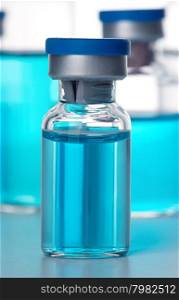 Vials of the vaccine, blue background