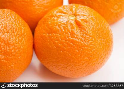 Vibrant mandarin fruit on a white background.