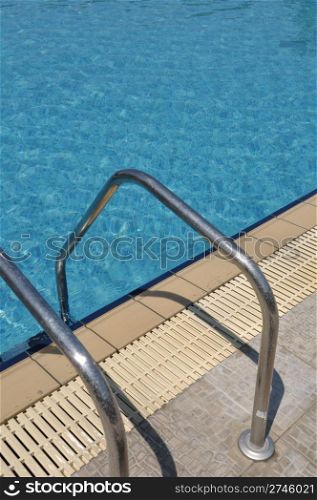 vibrant swimming pool side with ladder