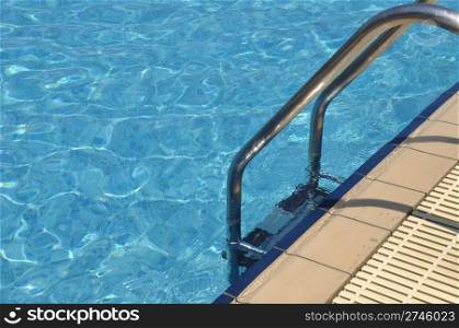 vibrant swimming pool side with ladder