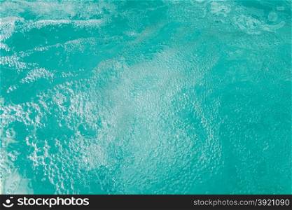 vibrant turquoise water bubbles in the jacuzzi