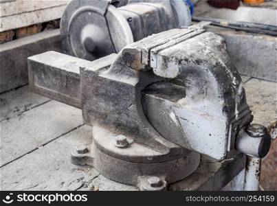Vices on the bench. Ordinary vise. Equipment in the workshop.. Vices on the bench. Ordinary vise. Equipment in the workshop