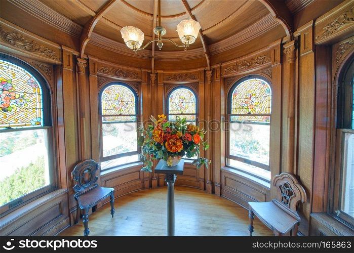 VICTORIA, CANADA - AUGUST 15, 2017: Craigdarroch Castle interior. VICTORIA, CANADA - AUGUST 15, 2017: Craigdarroch Castle interior with old furniture. It is a historic Victorian-era Scottish Baronial mansion.
