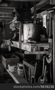 Victorian era plumbers workshop with tools and shelves