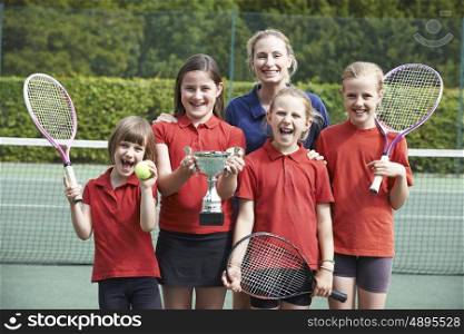Victorious School Tennis Team With Trophy