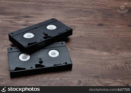 Video cassettes isolated on a wooden background