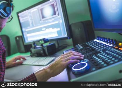 Video editing, recording and cutting room with monitors and sound mixing desk