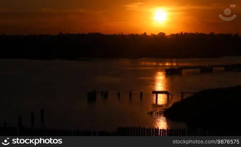 A spectacular sunset in a harbor when no one's around