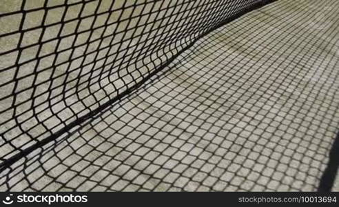 A tennis ball flies in the net and keeps hanging - point loss