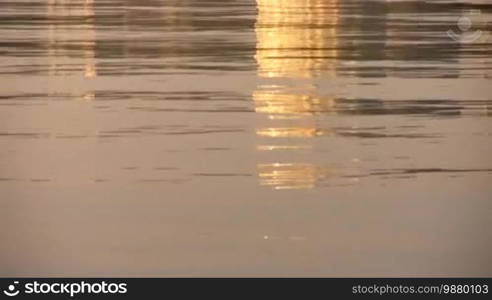 Abstraction in river reflection.