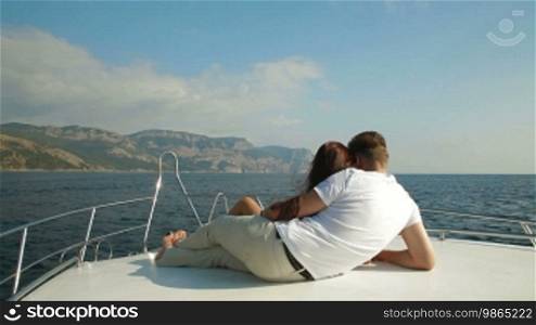 Adult Couple Relaxing on a Speedboat