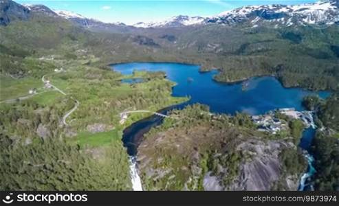 Aerial footage Beautiful Nature Norway. Flying over the lakes and fjords. View from the bird's-eye view.