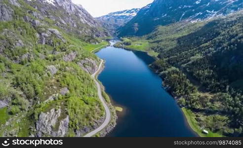 Aerial footage Beautiful Nature Norway. Flying over the lakes and fjords. View from the bird's-eye view.