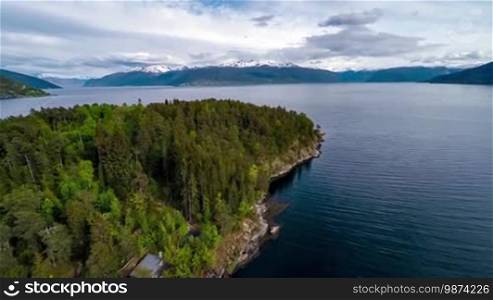 Aerial footage Beautiful Nature Norway. Flying over the lakes and fjords. View from the bird's-eye view.
