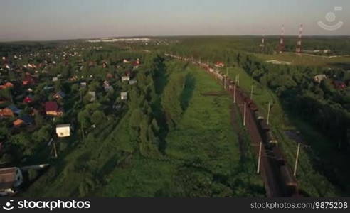 Aerial - Freight trains making their way through the countryside, Russia