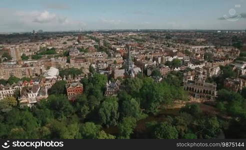 Aerial panorama of Amsterdam with houses, Vondelpark and Vondel Church. Dutch capital