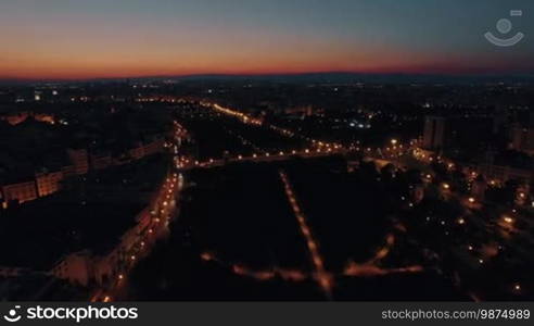 Aerial shot of night city lights and transport traffic in Valencia, Spain