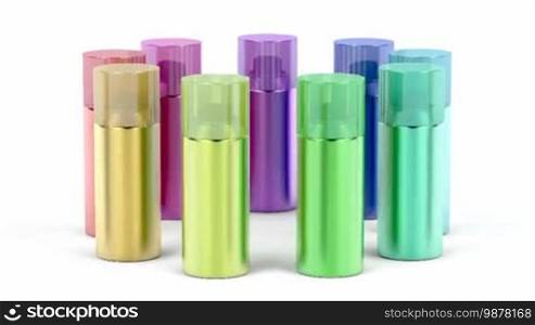 Aerosol spray cans with different colors on white background