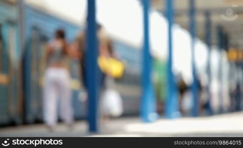 Anonymous people go through the railway station