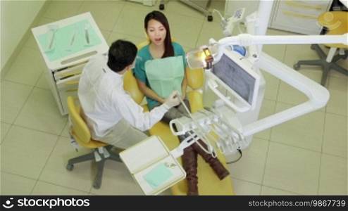 Asian dentist visiting girl in dental studio with tools and equipment, people and oral hygiene, health care and medicine in clinic lab. 18 of 19