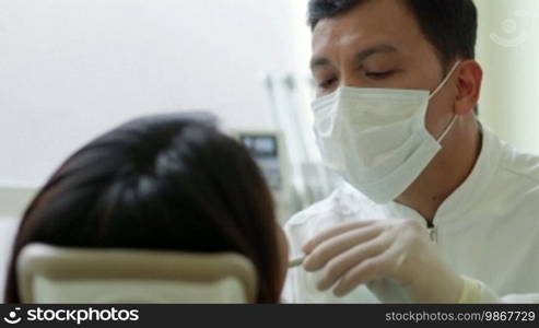 Asian dentist visiting young woman in dental studio, people and oral hygiene, health care in hospital. 2 of 19