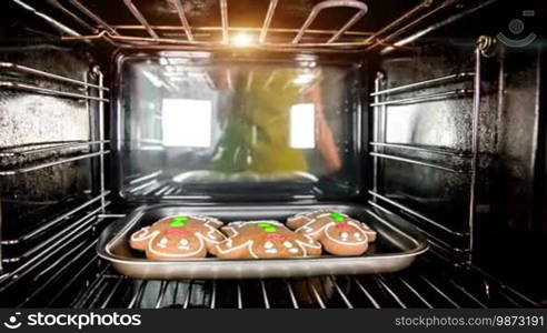 Baking Gingerbread man in the oven, view from the inside of the oven. Cooking in the oven.