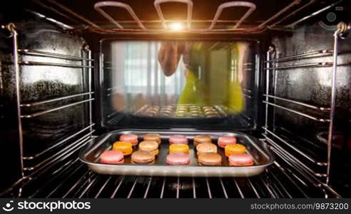 Baking macarons in the oven view from the inside of the oven. Cooking in the oven.