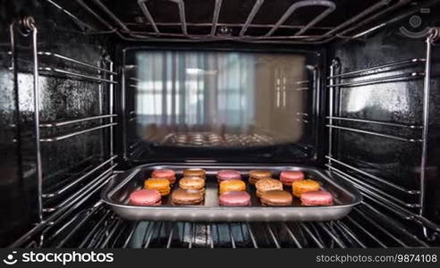 Baking macarons in the oven view from the inside of the oven. Cooking in the oven.