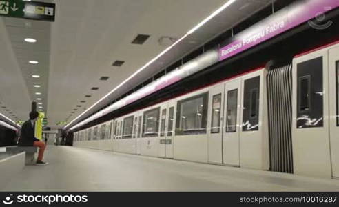 BARCELONA - AUGUST 12, 2012: Time lapse subway and passengers at Barcelona's underground (Badalona station)