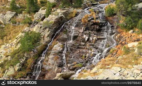 Beautiful veil cascading waterfall, mossy rocks