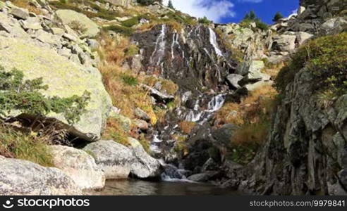 Beautiful veil cascading waterfall, mossy rocks