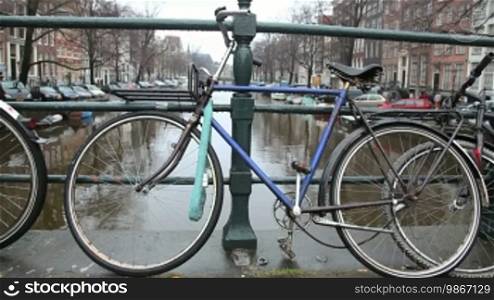 Bicycles parked along the canals in Amsterdam, Holland. Sequence