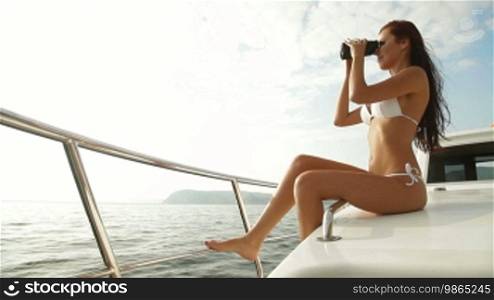 Bikini Beauty With Binoculars on Luxury Yacht