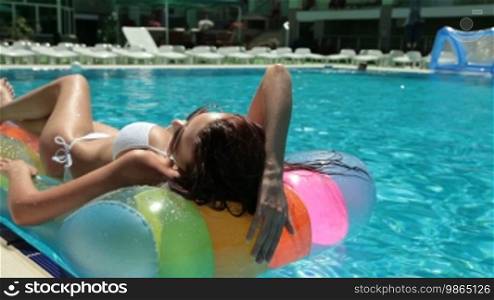 Bikini Female Sunbathing by the Pool